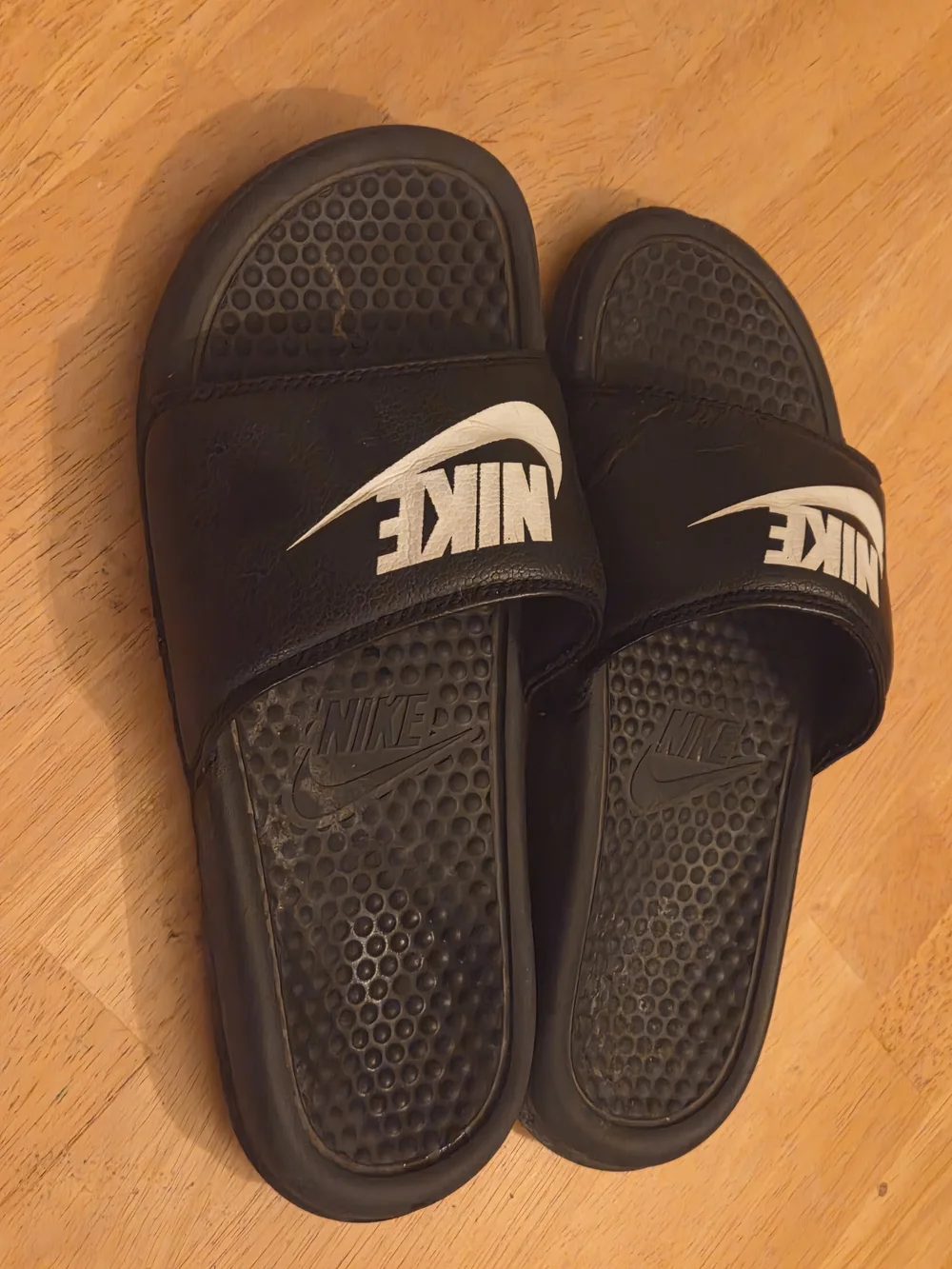 Nike Black Slides with White Swoosh Logo
